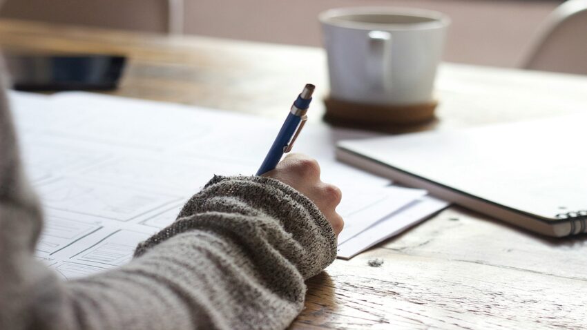 Image of a person studying at a desk.